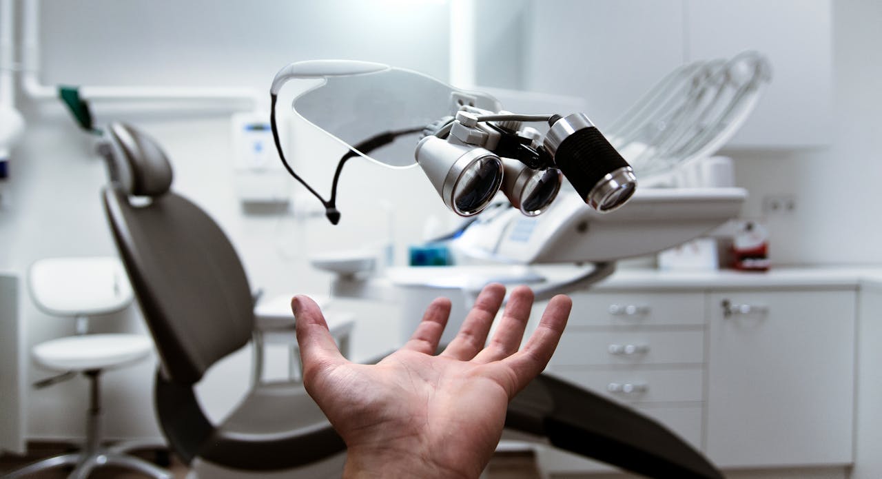 about-us Floating dental loupes in a modern, clean dentist office setting.