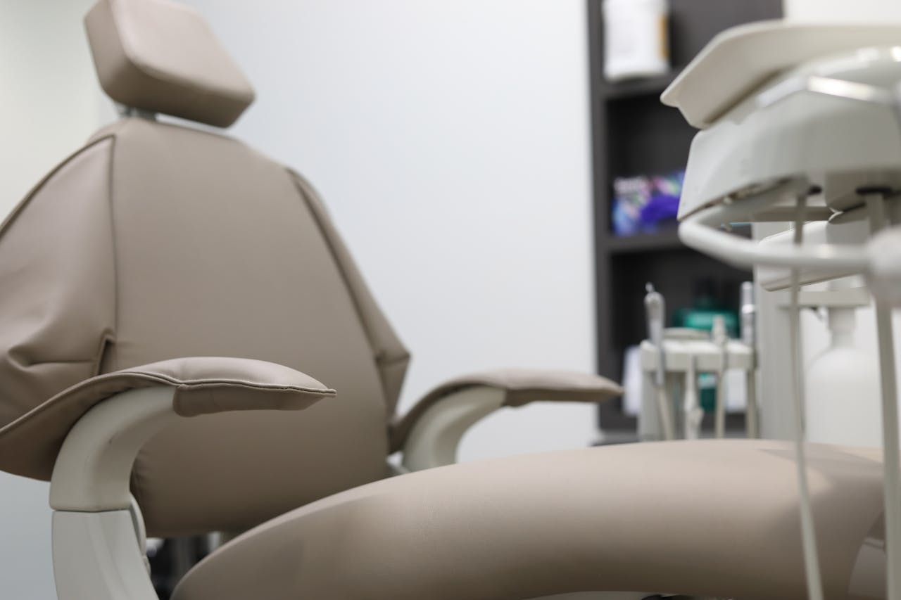 services-05 Close-up of dental chair and equipment in a clinical setting, emphasizing healthcare technology.